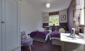 purple thistle themed twin room holiday let Port William