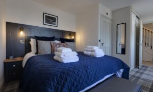 westview cottage navy blue coo room master bedroom complete with towels